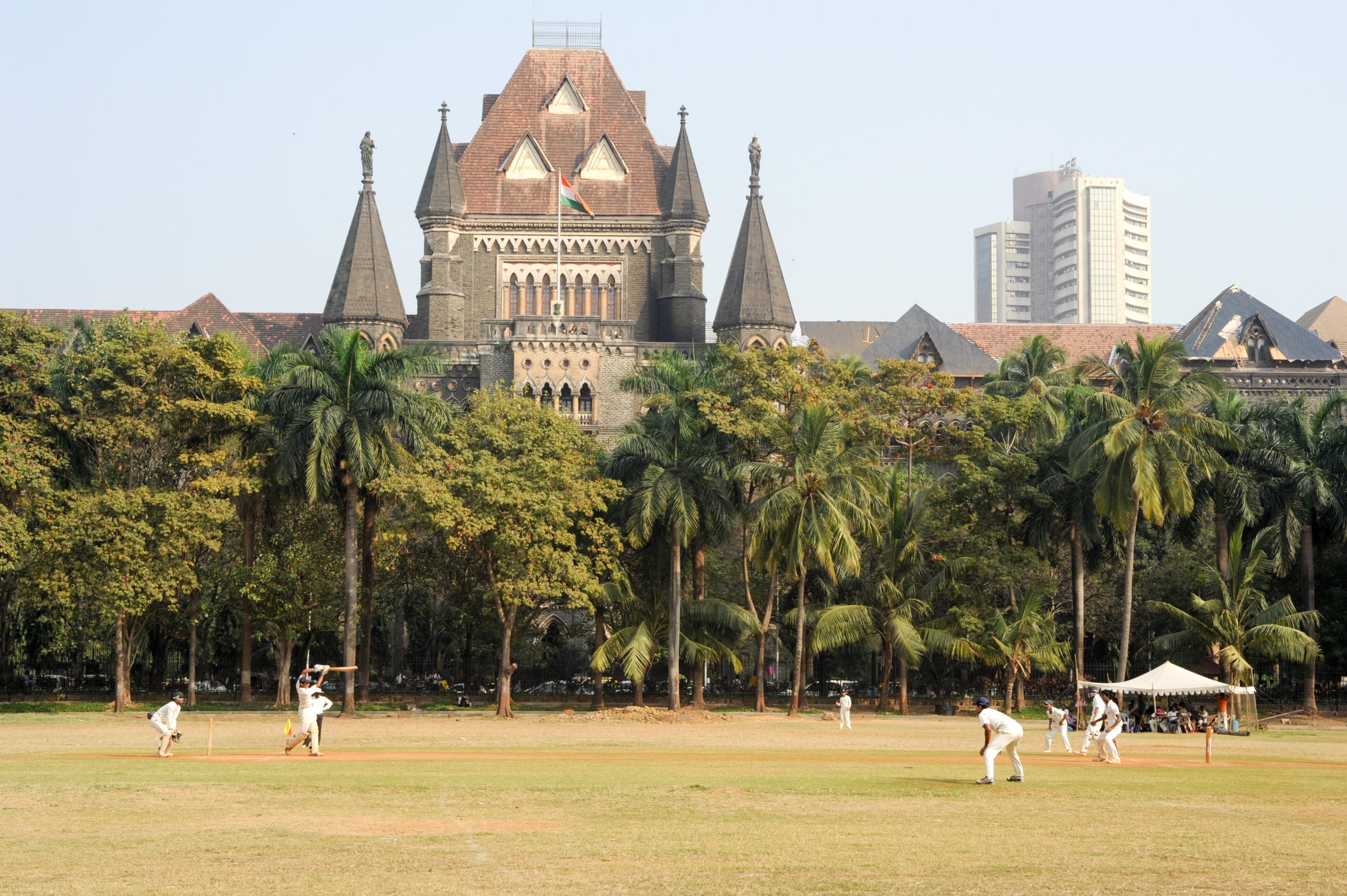 People playing cricket in the central park at Mumbai