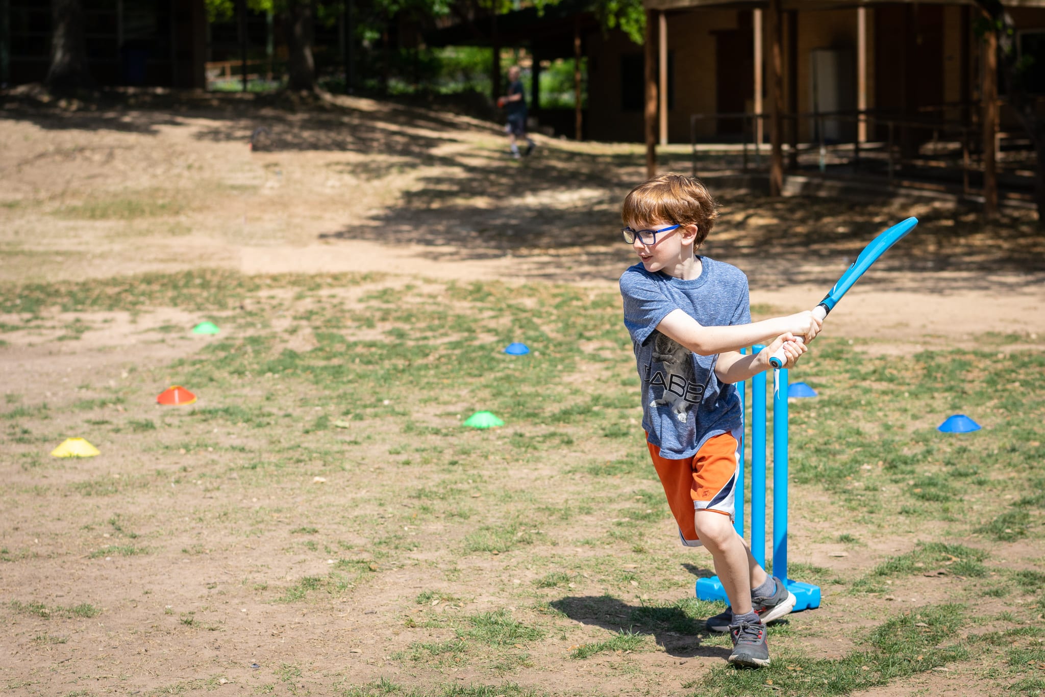 boy batting ball