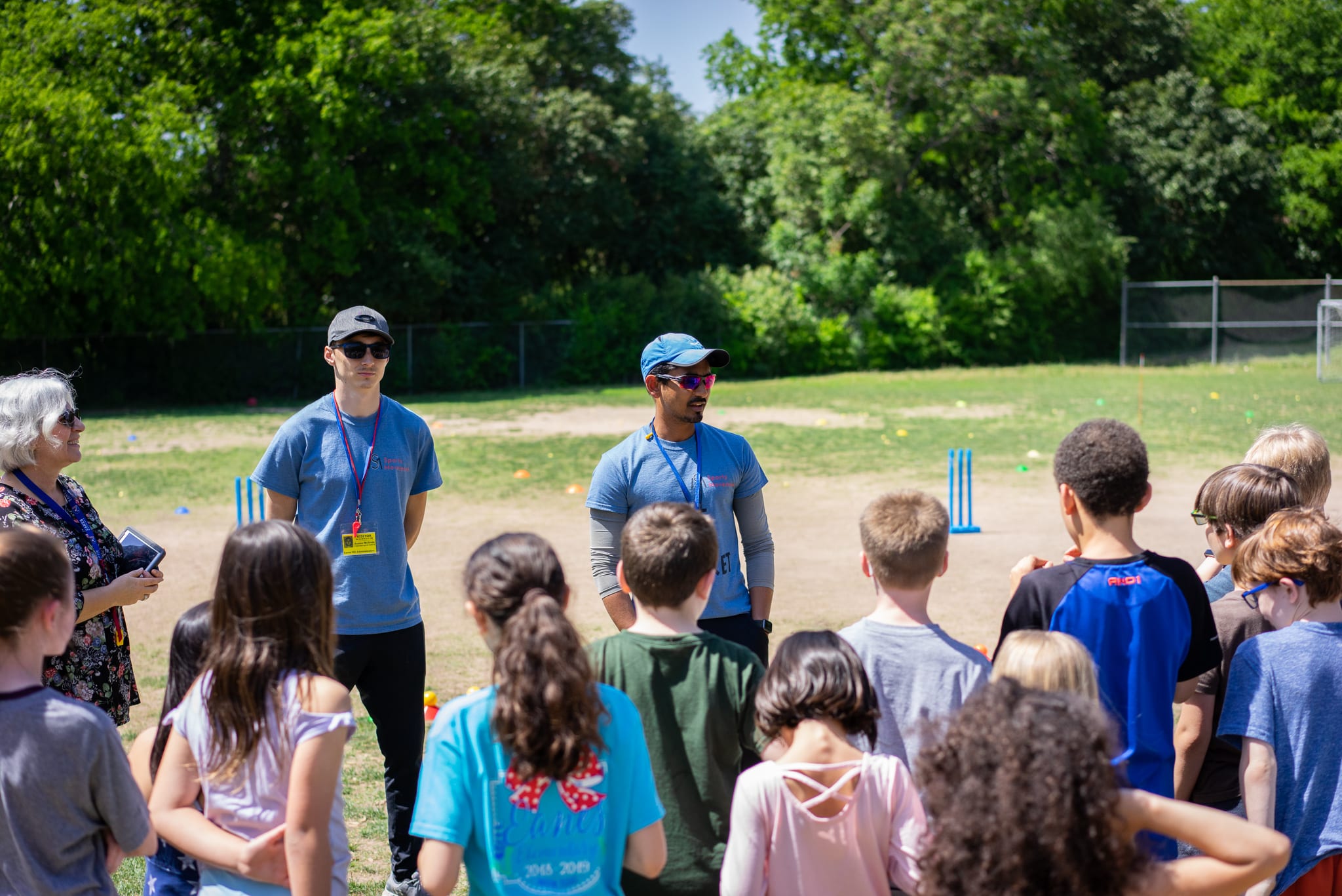 coaches and teachers introducing themselves to students