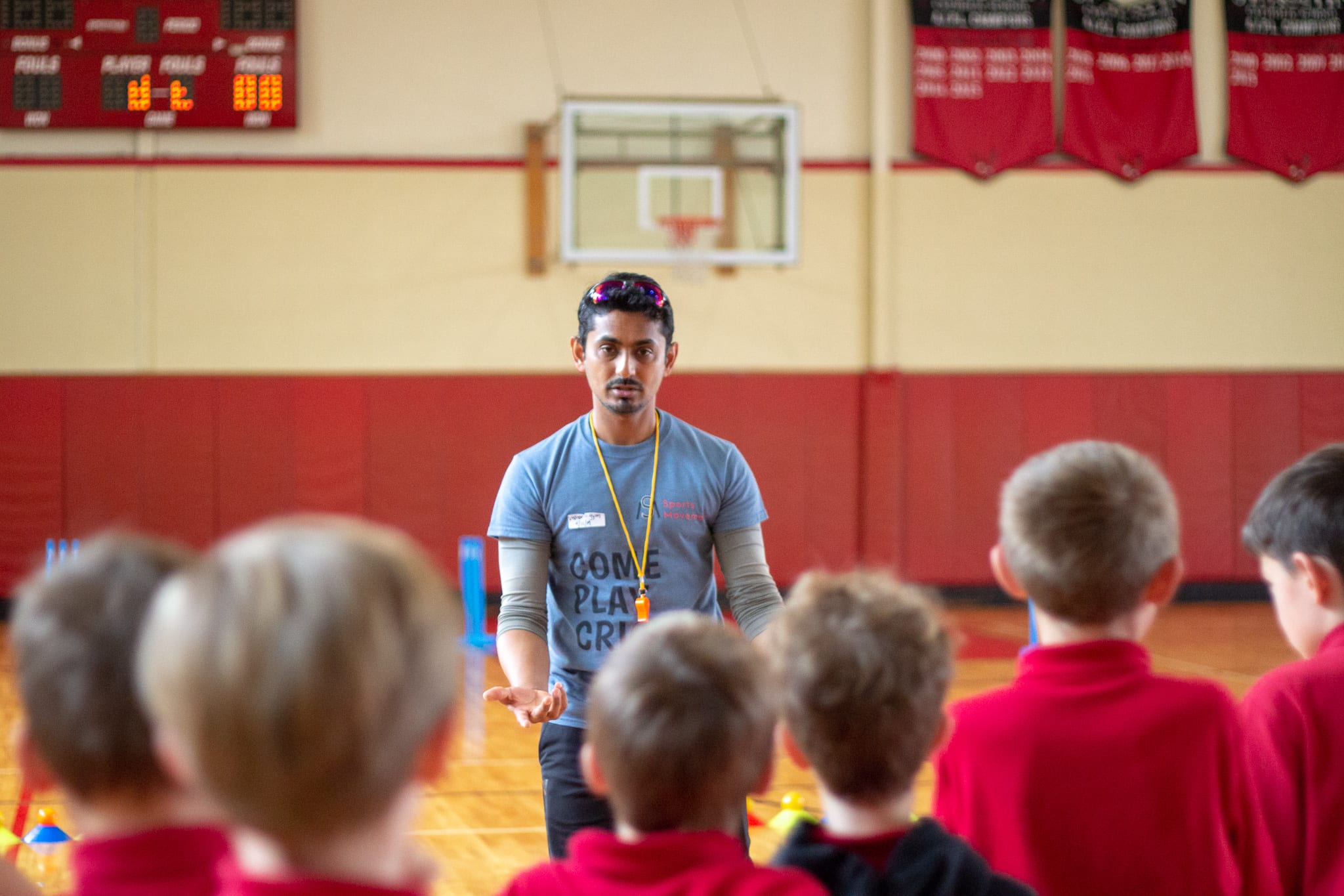 coach raghav talking to student athletes